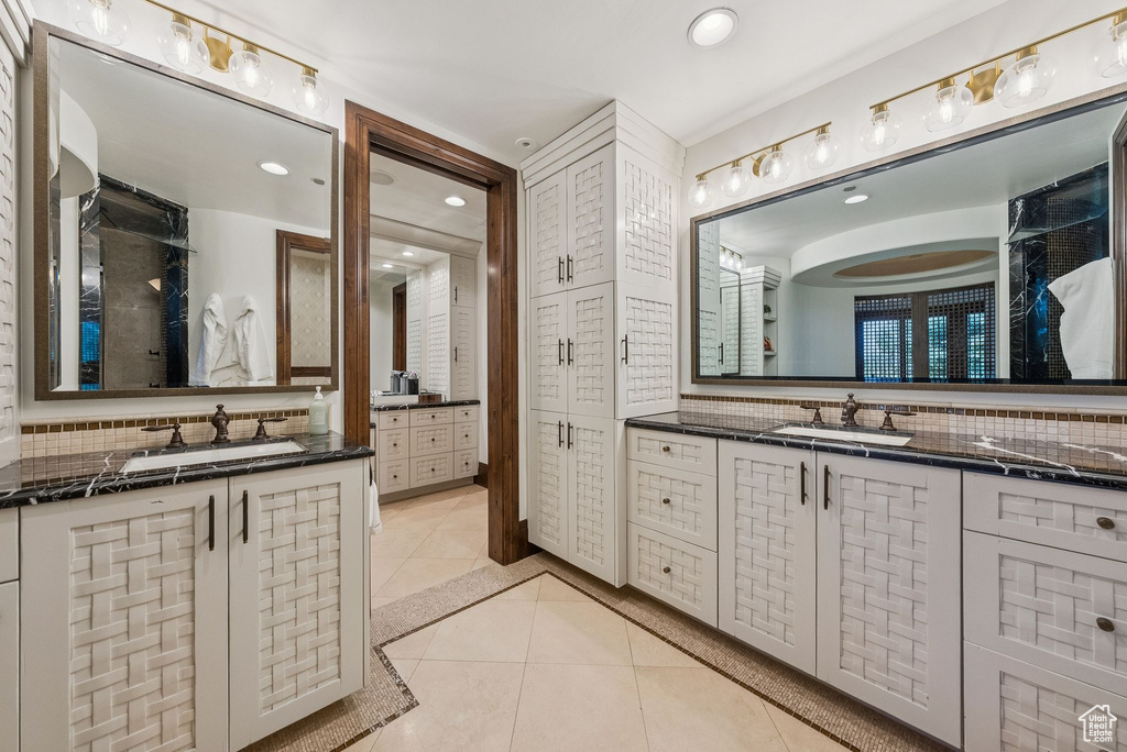 Full bath with tile patterned flooring, backsplash, two vanities, and recessed lighting