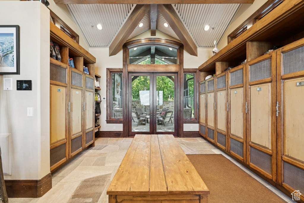 Mudroom featuring french doors, beam ceiling, recessed lighting, and high vaulted ceiling