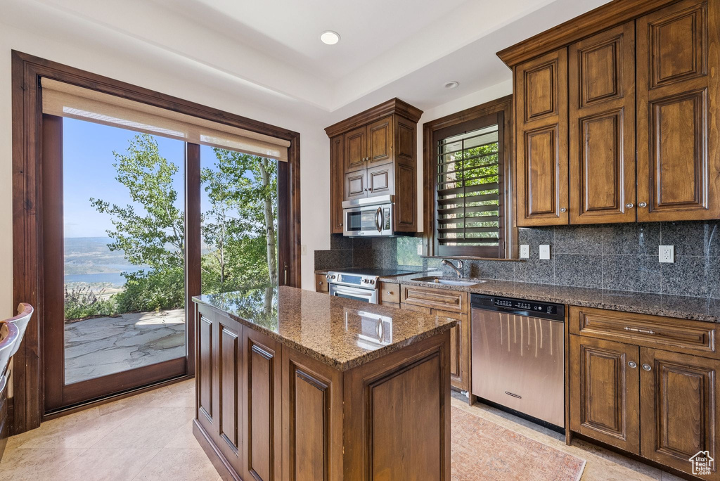 Kitchen featuring stainless steel appliances, tasteful backsplash, plenty of natural light, and recessed lighting