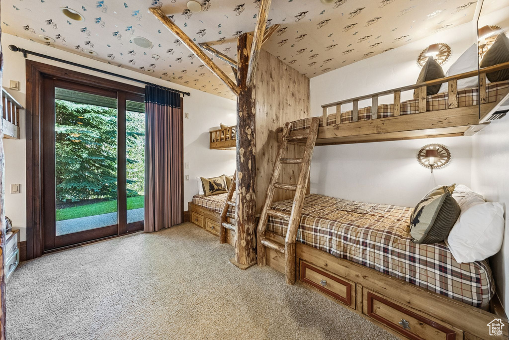 Carpeted bedroom featuring access to exterior