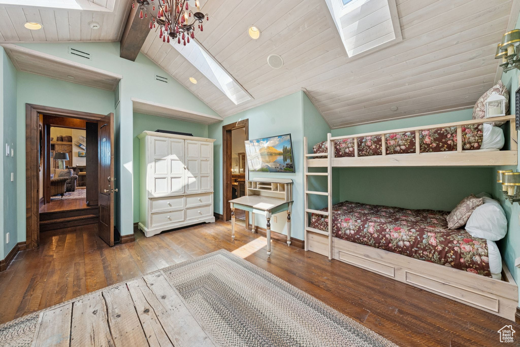 Bedroom with a skylight and hardwood / wood-style floors
