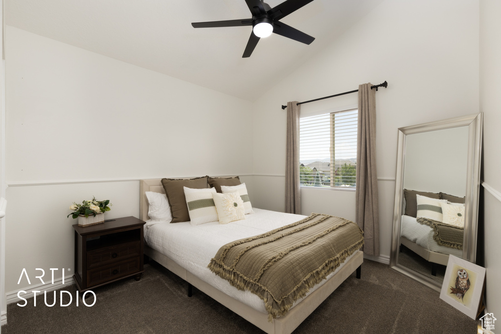 Bedroom featuring dark carpet, a ceiling fan, and high vaulted ceiling