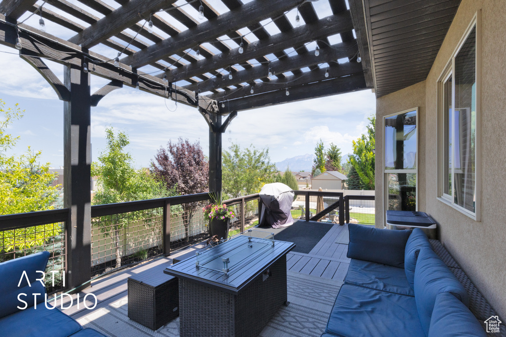 Deck with area for grilling and a pergola