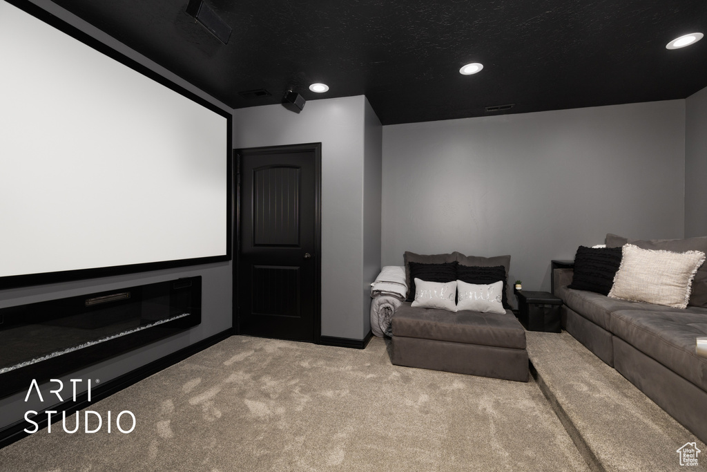 Home theater room featuring carpet floors and recessed lighting