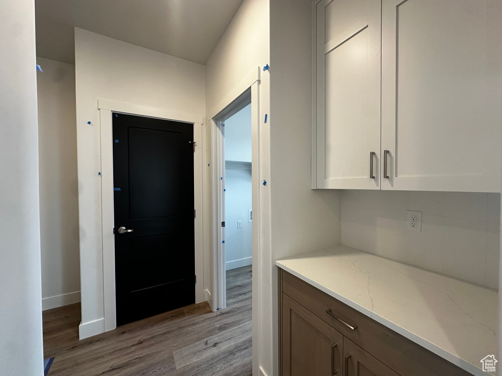 Hallway with light wood-style flooring