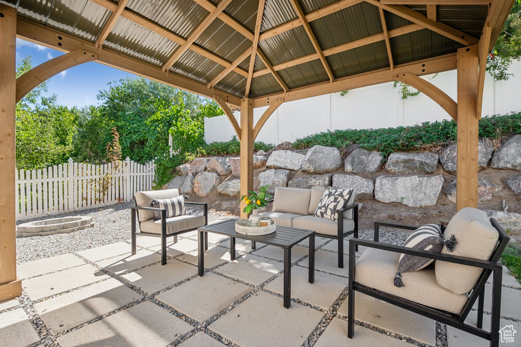 View of patio featuring a gazebo and an outdoor living space