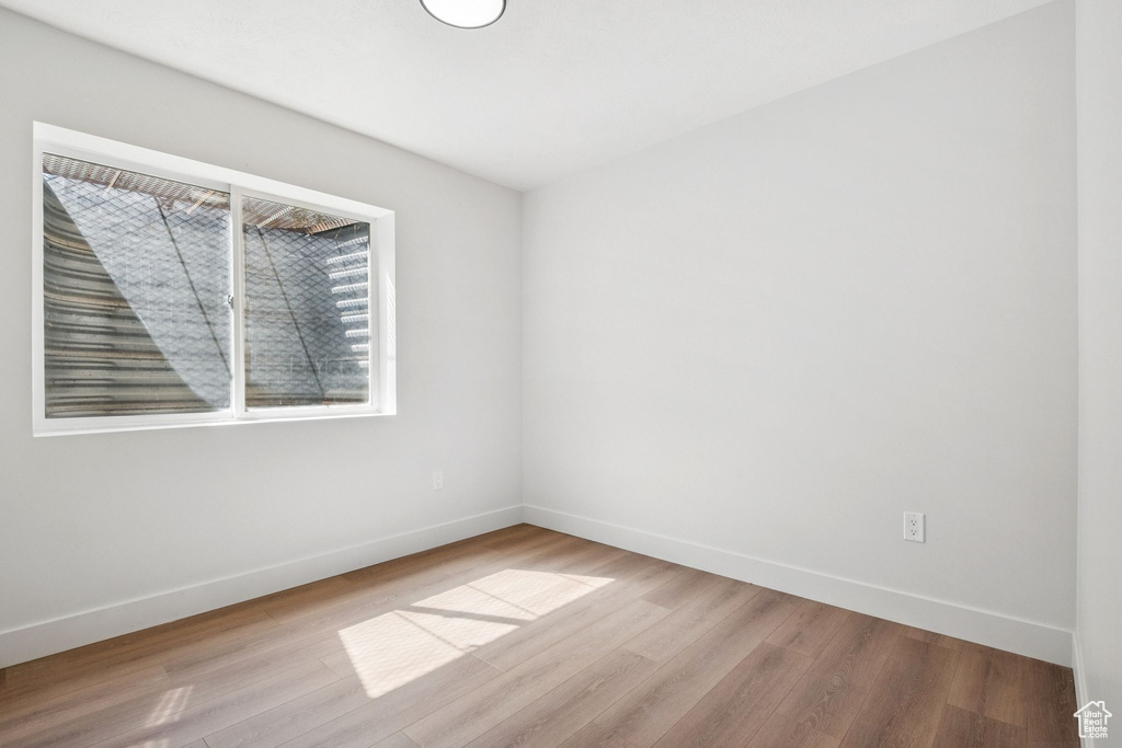 Spare room with wood finished floors