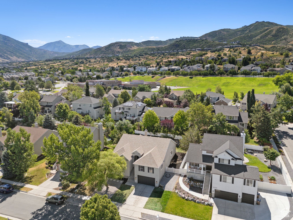 Aerial view of residential area with a mountainous background