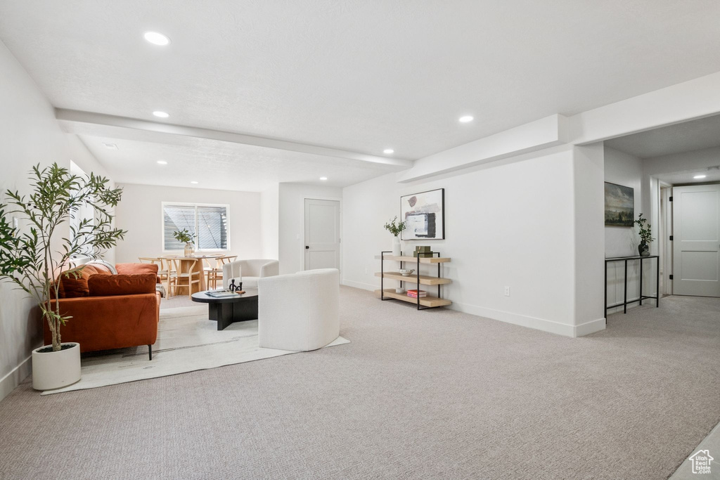 Carpeted living room with recessed lighting