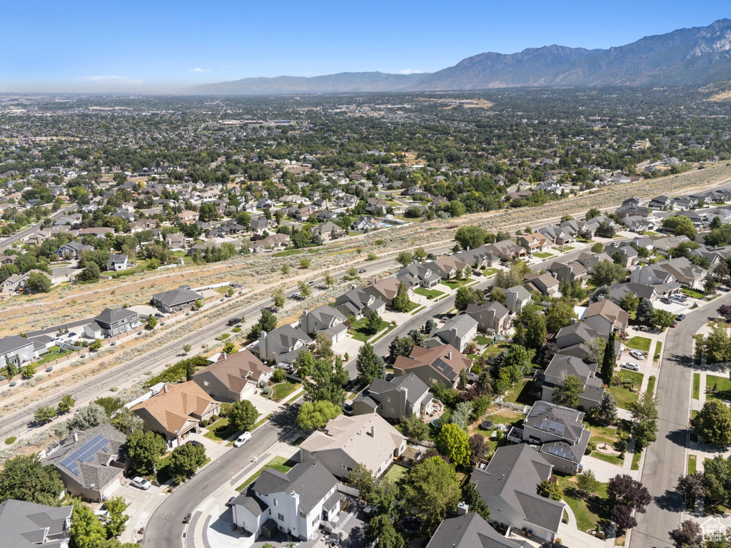Aerial view of property\'s location with mountains and nearby suburban area