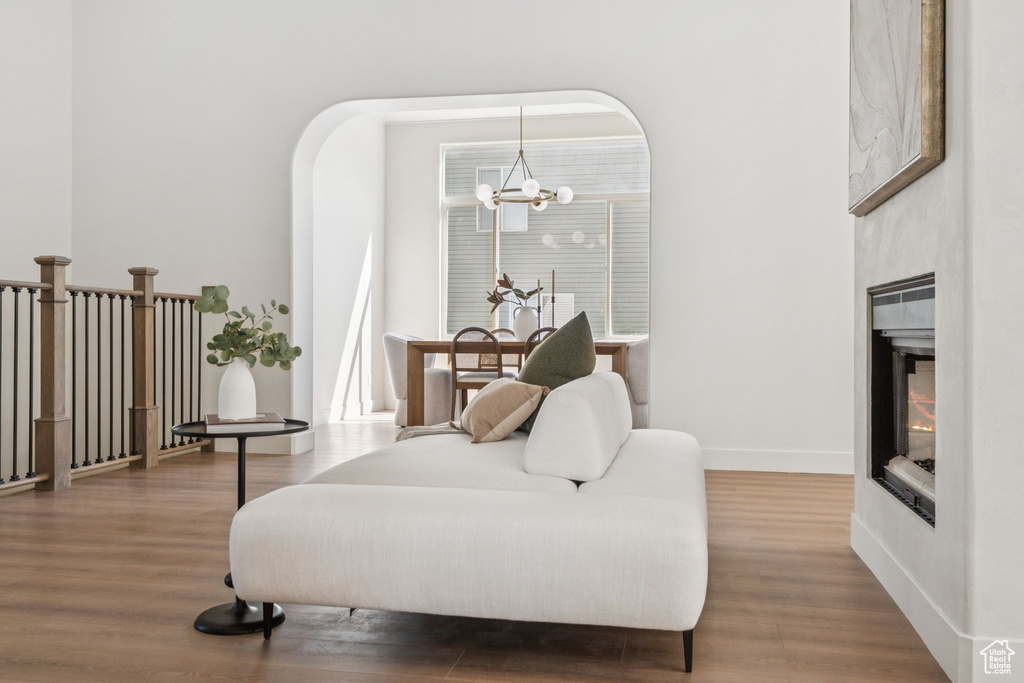 Living area featuring a chandelier and wood finished floors