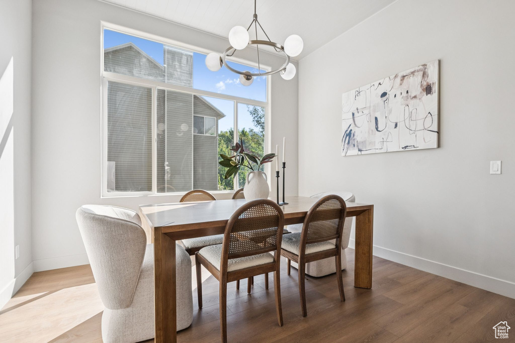 Dining room with a chandelier and light wood-style flooring