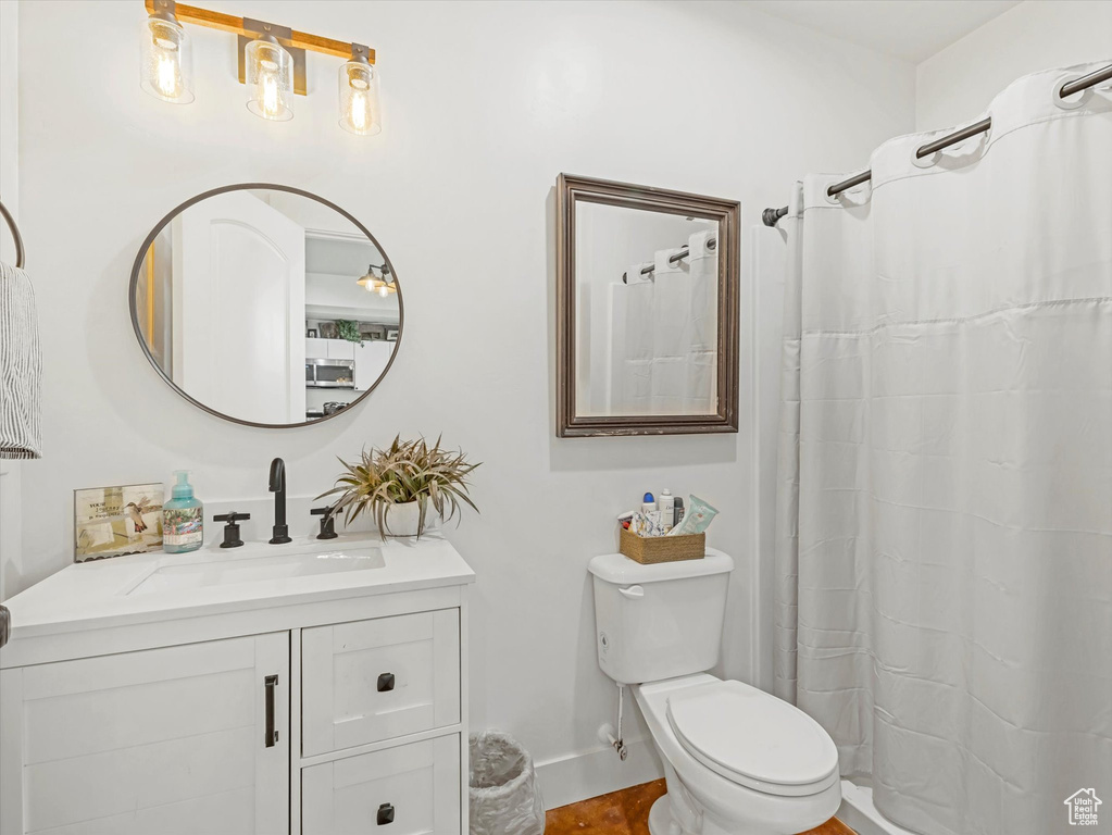 Full bath with vanity and a shower with curtain