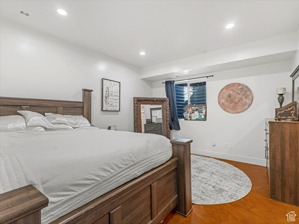 Bedroom featuring recessed lighting and wood finished floors
