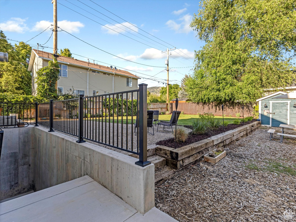 Fenced backyard with a patio