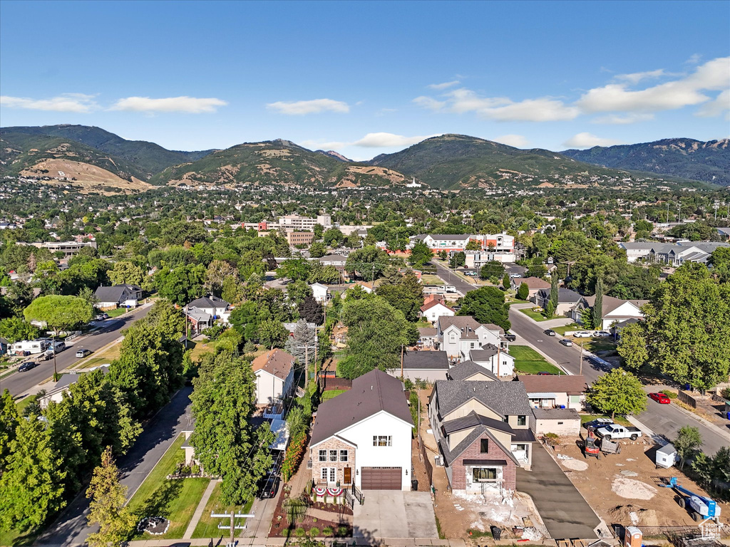 Aerial perspective of suburban area with a mountain backdrop