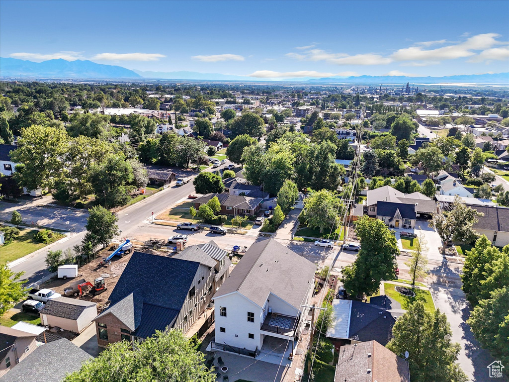 Aerial view of residential area featuring a mountain backdrop