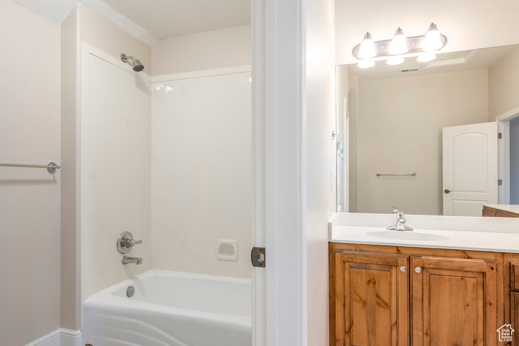 Bathroom featuring vanity and bathing tub / shower combination