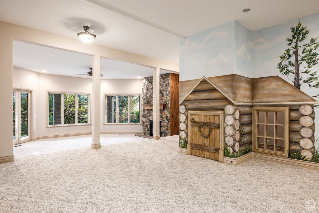 Unfurnished living room featuring carpet floors, a ceiling fan, and recessed lighting