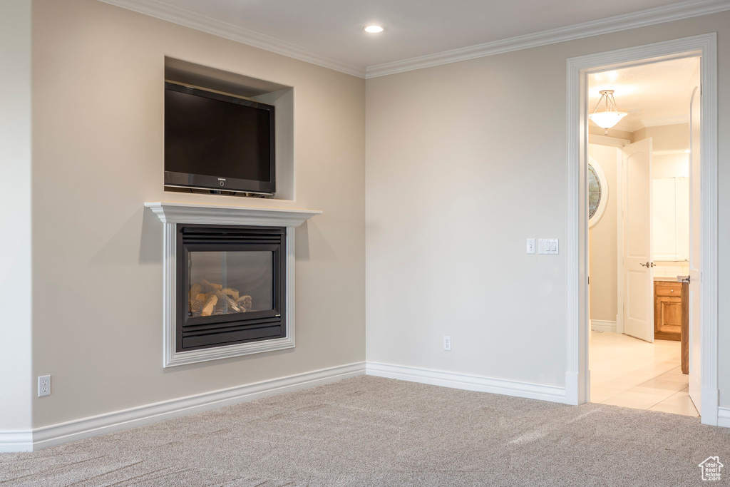 Unfurnished living room featuring carpet floors, a multi sided fireplace, crown molding, and recessed lighting