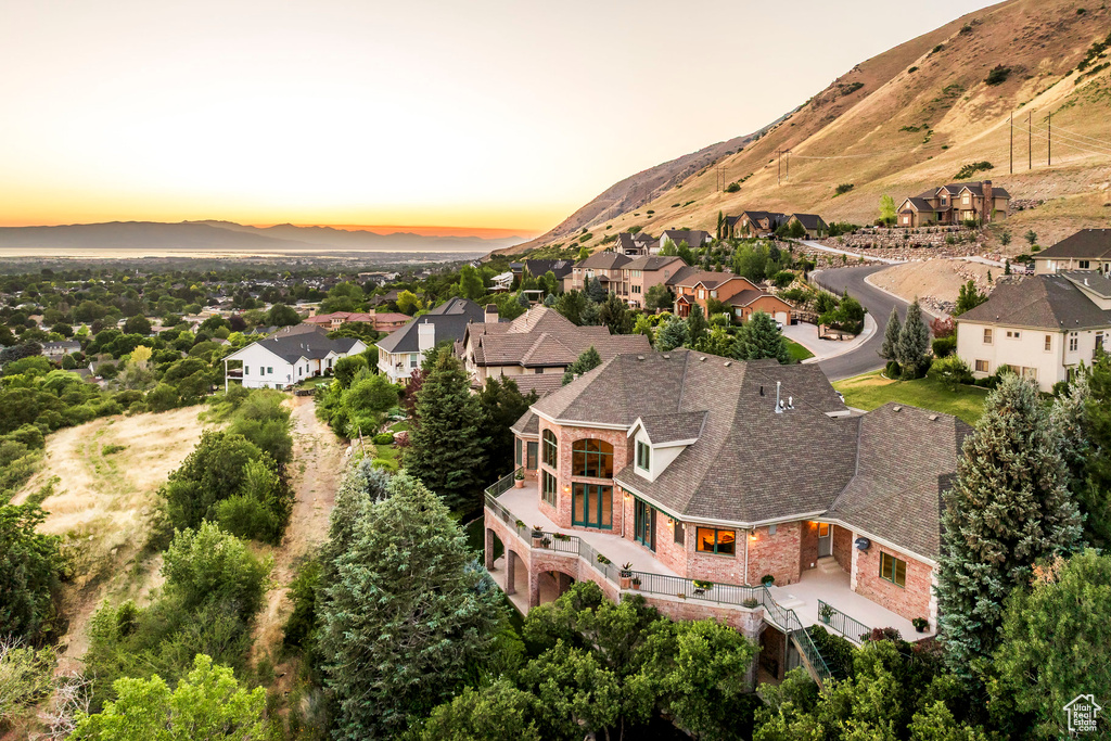 Aerial view at dusk of a mountain view and a residential view