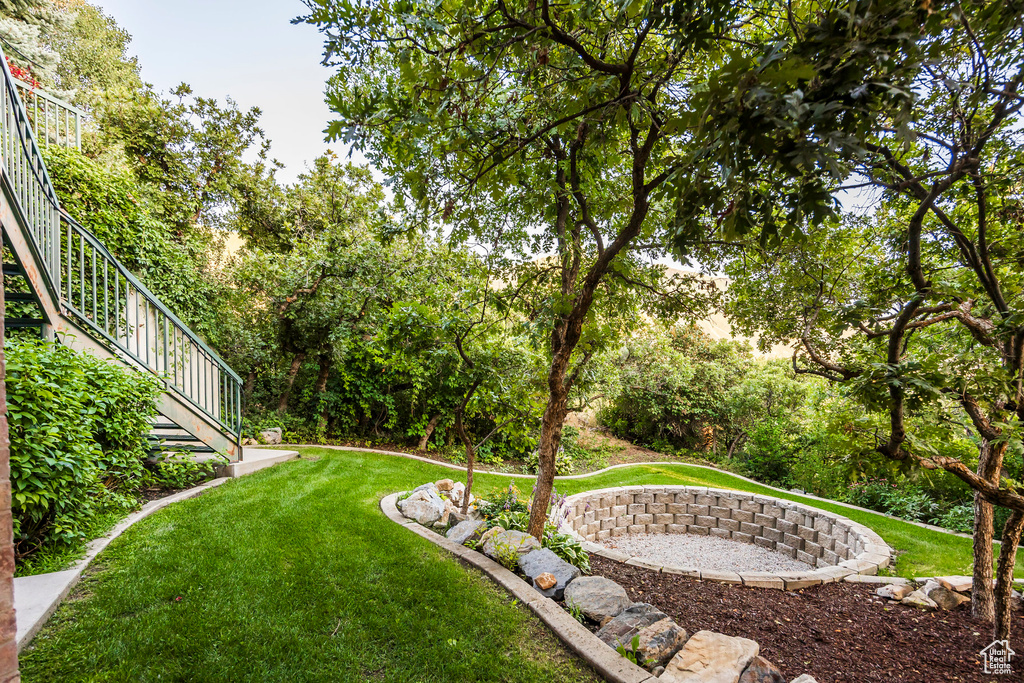 View of grassy yard with stairway