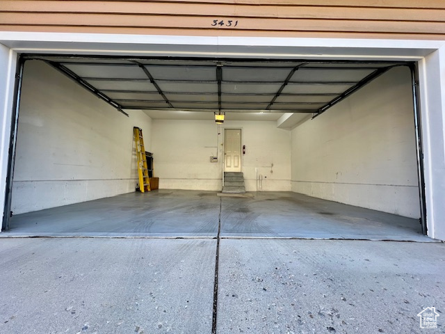 Garage featuring a garage door opener