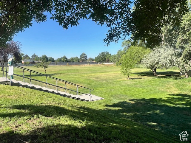 View of property\'s community with a lawn and a rural view
