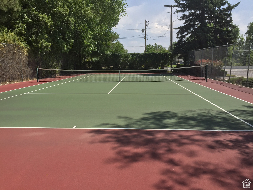 View of tennis court featuring community basketball court