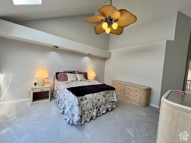 Carpeted bedroom featuring high vaulted ceiling and ceiling fan