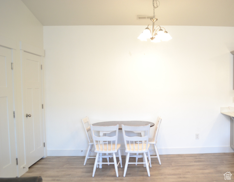 Dining room with wood finished floors and baseboards