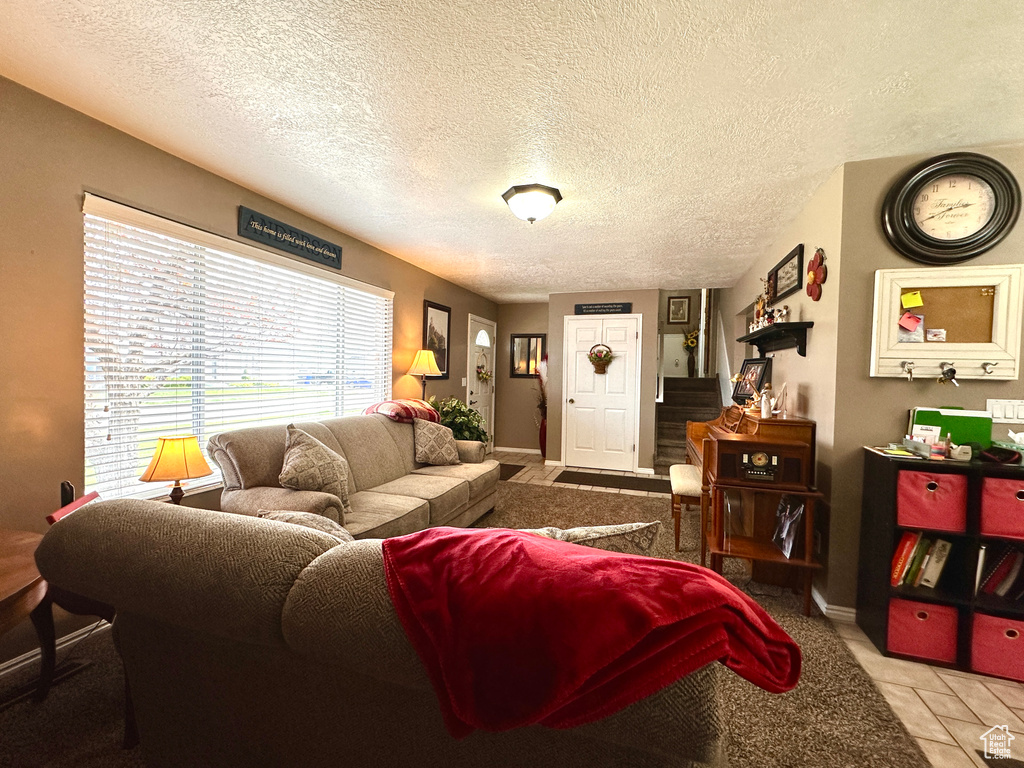 Living area featuring a textured ceiling