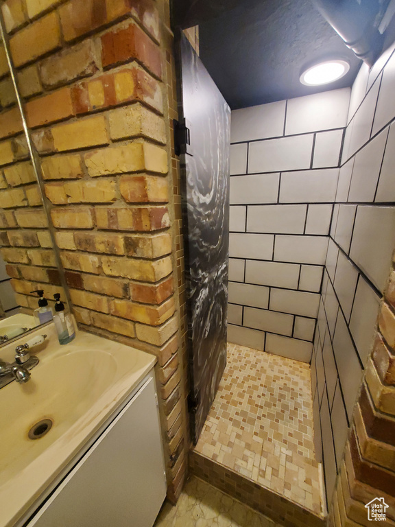 Bathroom with a stall shower and vanity