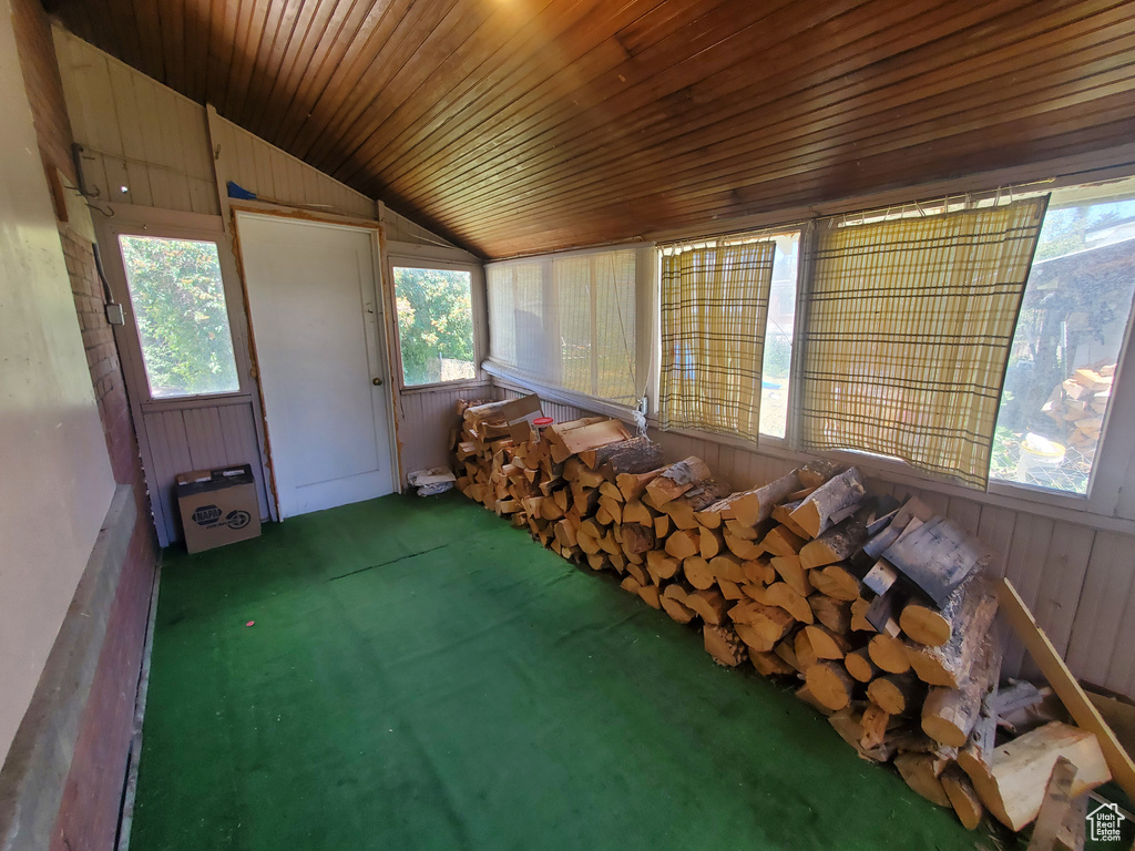 Sunroom / solarium featuring vaulted ceiling