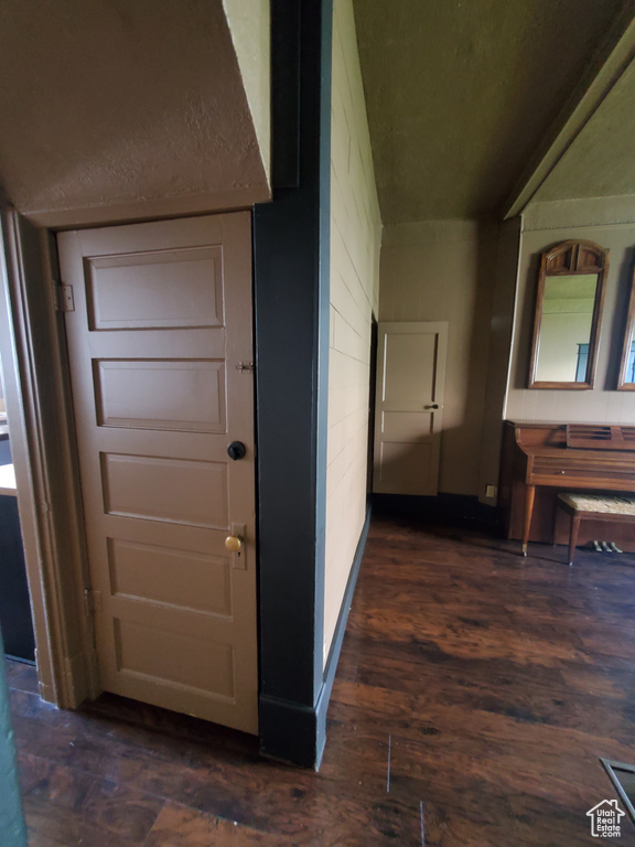 Hall with dark wood-type flooring