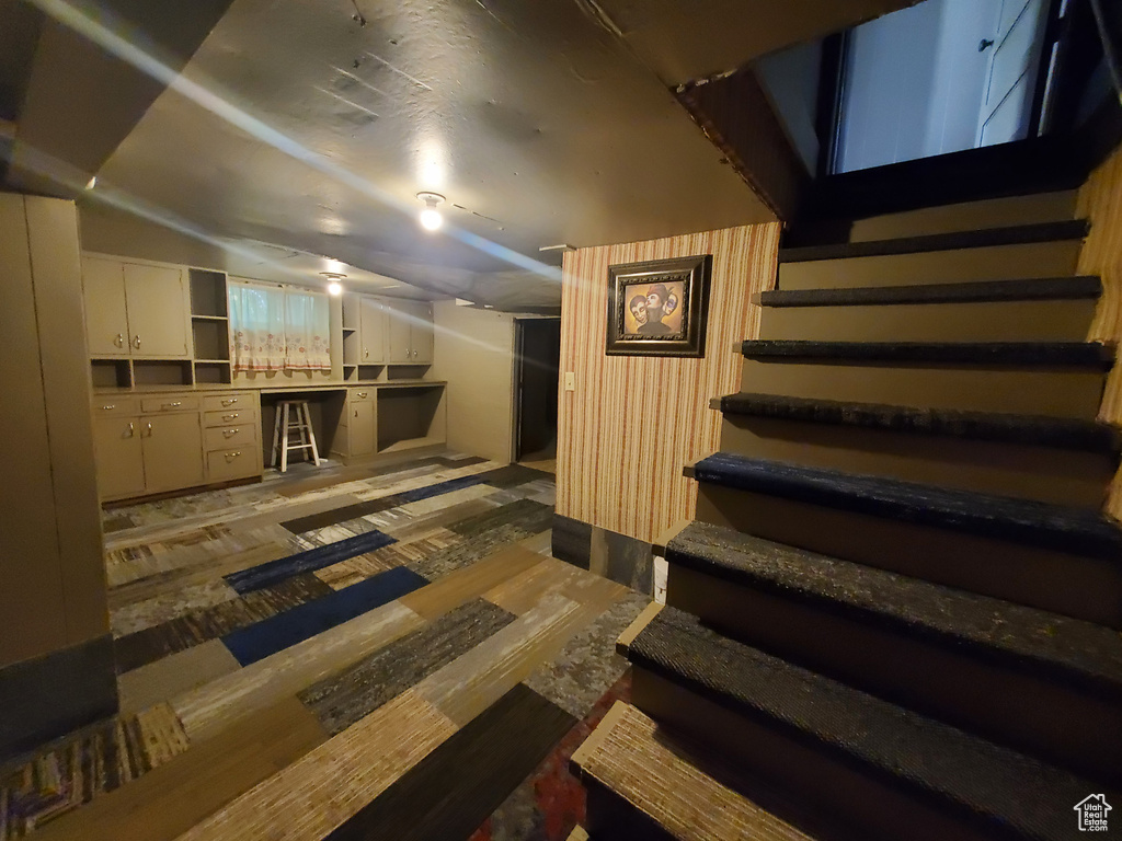 Finished below grade area featuring stairway