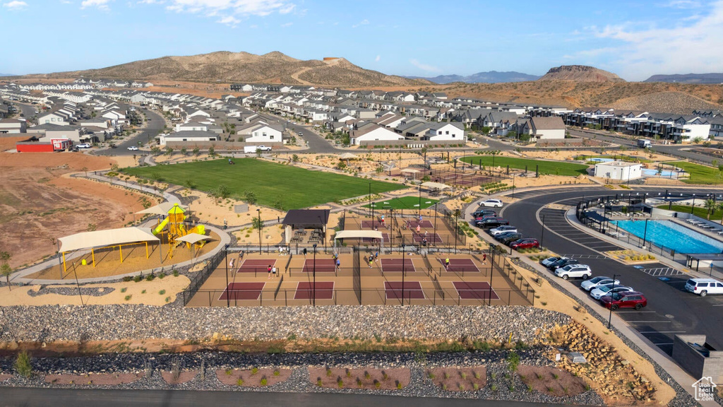 Aerial view of residential area featuring a mountainous background