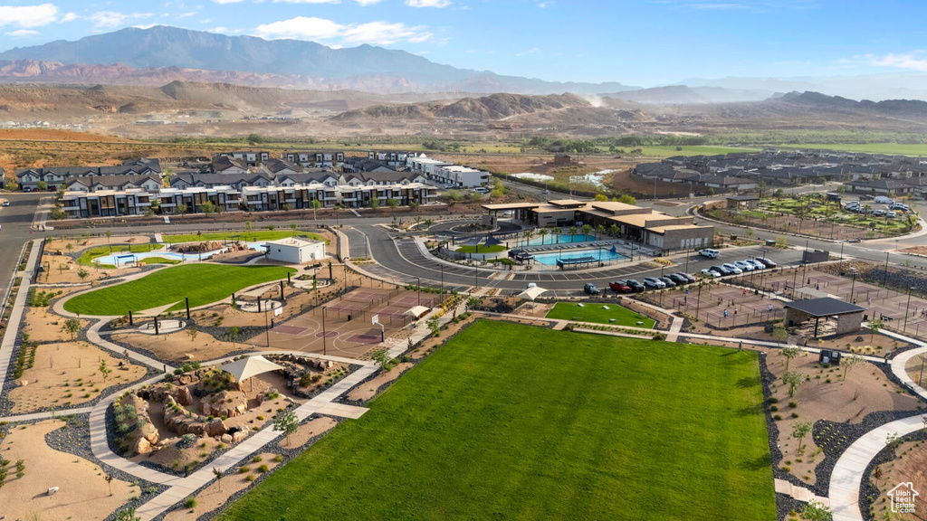 Aerial perspective of suburban area featuring a mountain backdrop