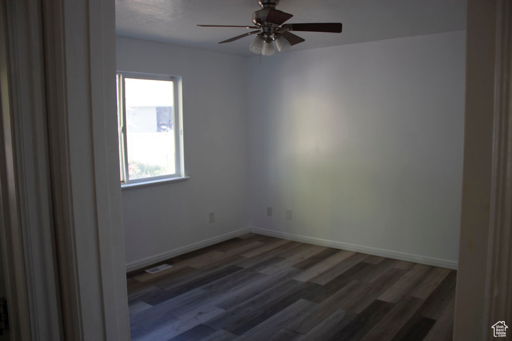 Spare room featuring ceiling fan and wood finished floors