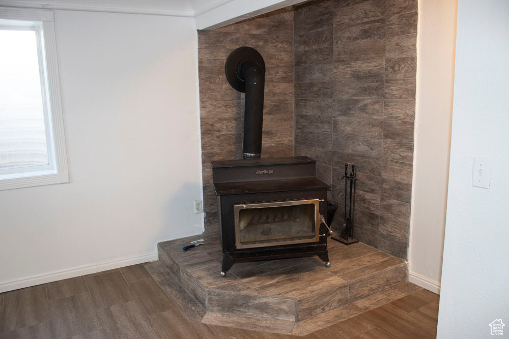 Detailed view of a wood stove and wood finished floors