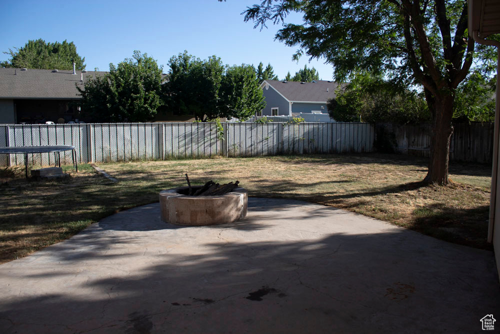 Fenced backyard featuring a patio area