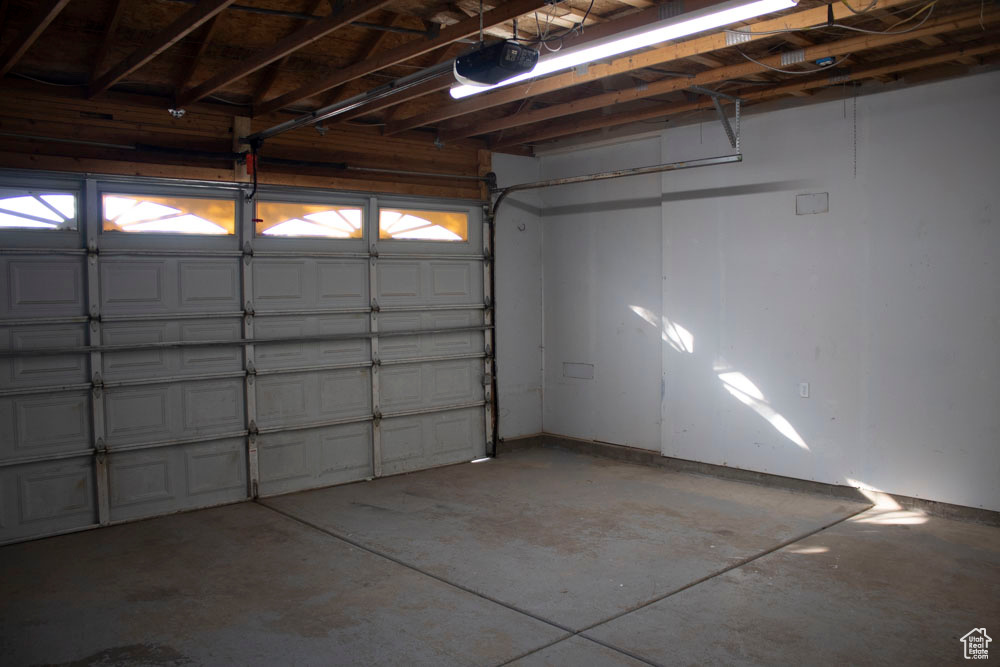 Garage featuring a garage door opener