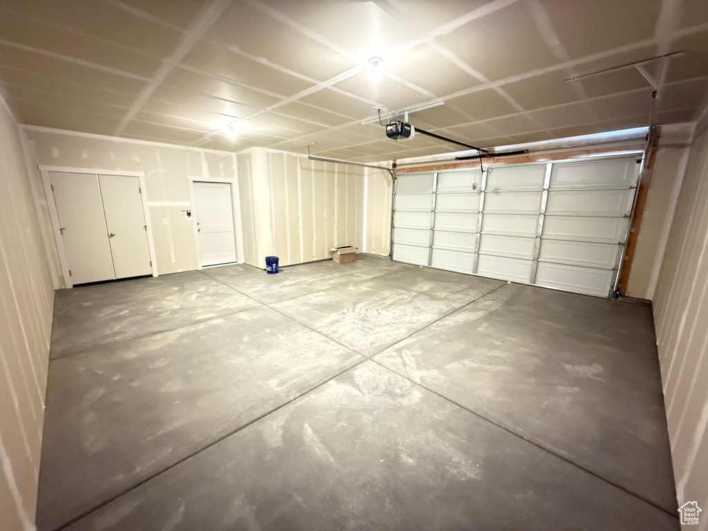 Garage featuring a garage door opener