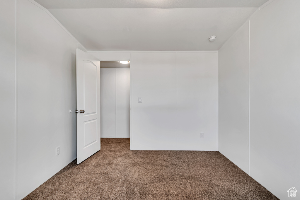 Unfurnished bedroom featuring carpet floors