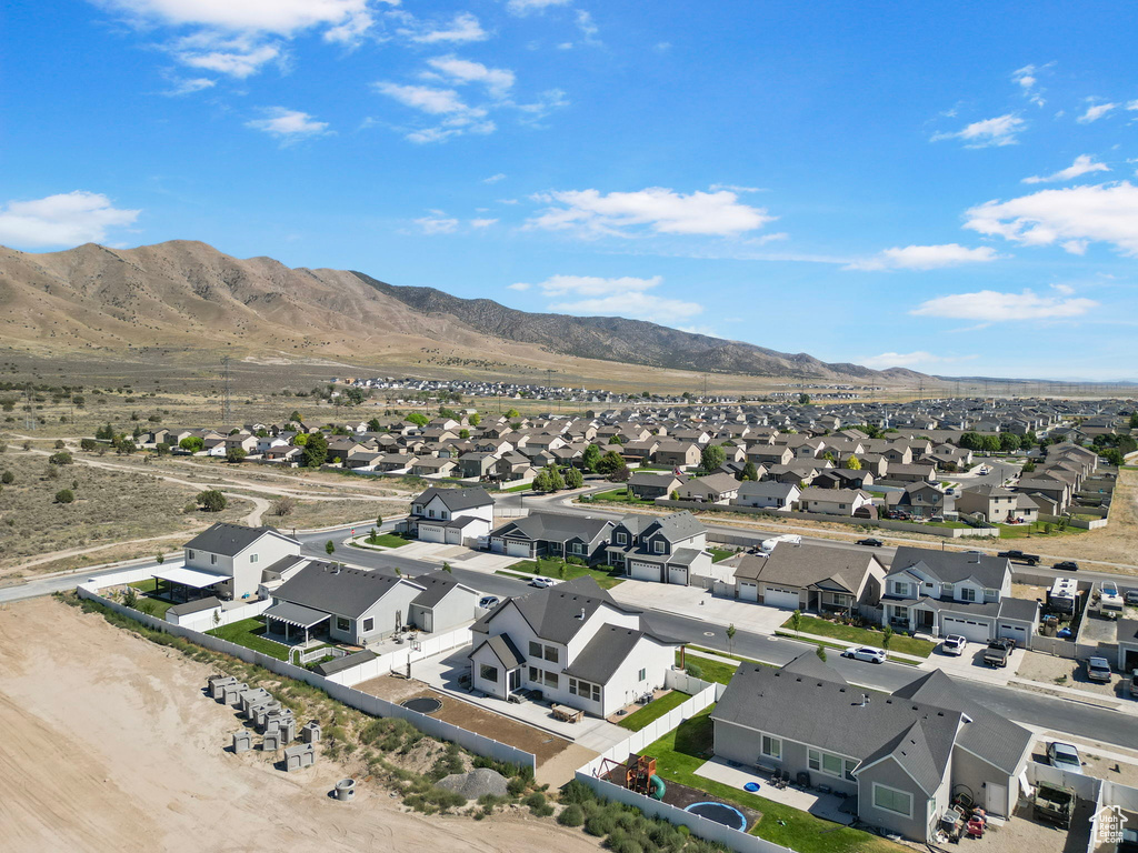 Aerial view of residential area featuring a mountain backdrop