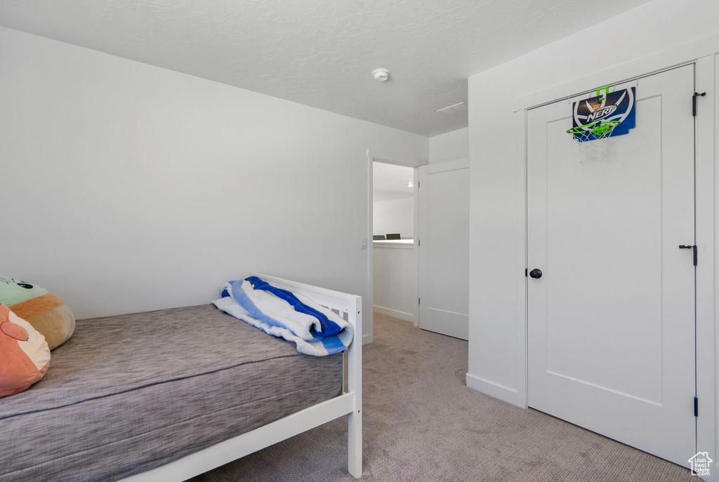Bedroom featuring carpet