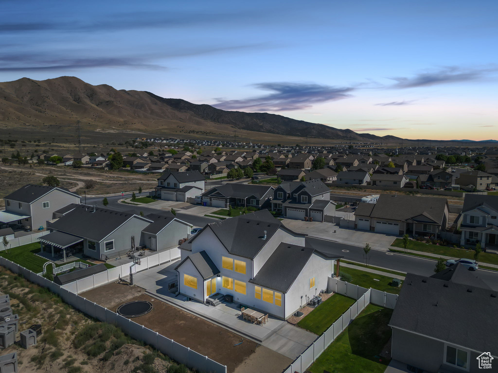 Aerial view at dusk of a residential view and a mountain view