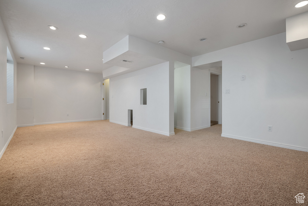 Unfurnished room featuring light colored carpet and recessed lighting
