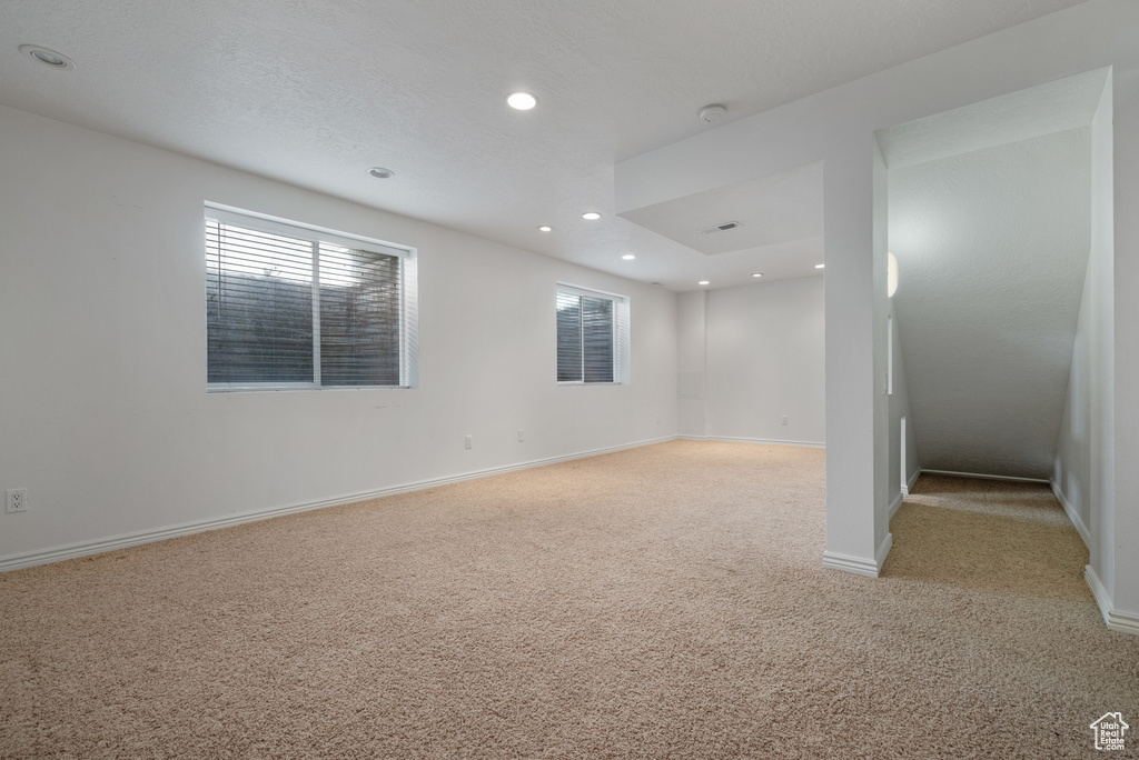 Unfurnished room featuring light colored carpet and recessed lighting