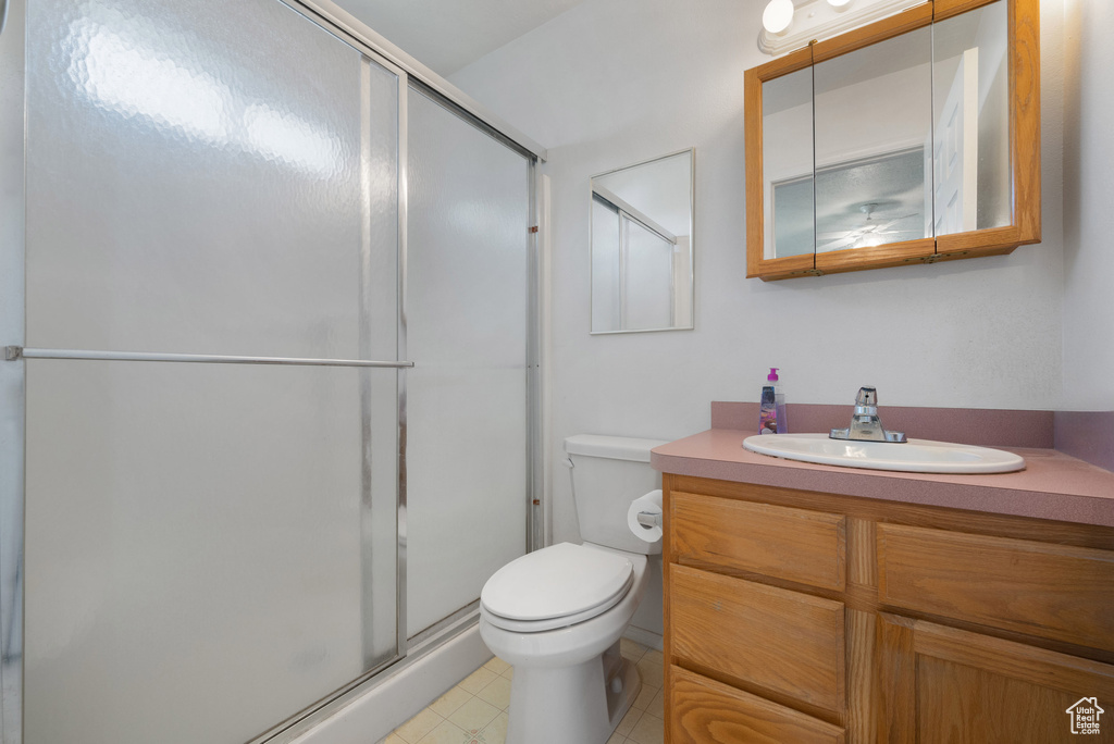 Bathroom with vanity and a stall shower